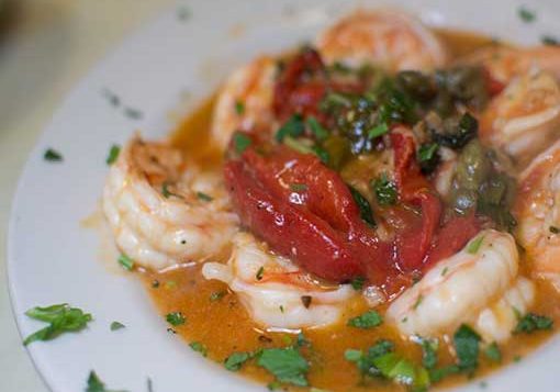 Shrimp Garlic dish on a white plate.